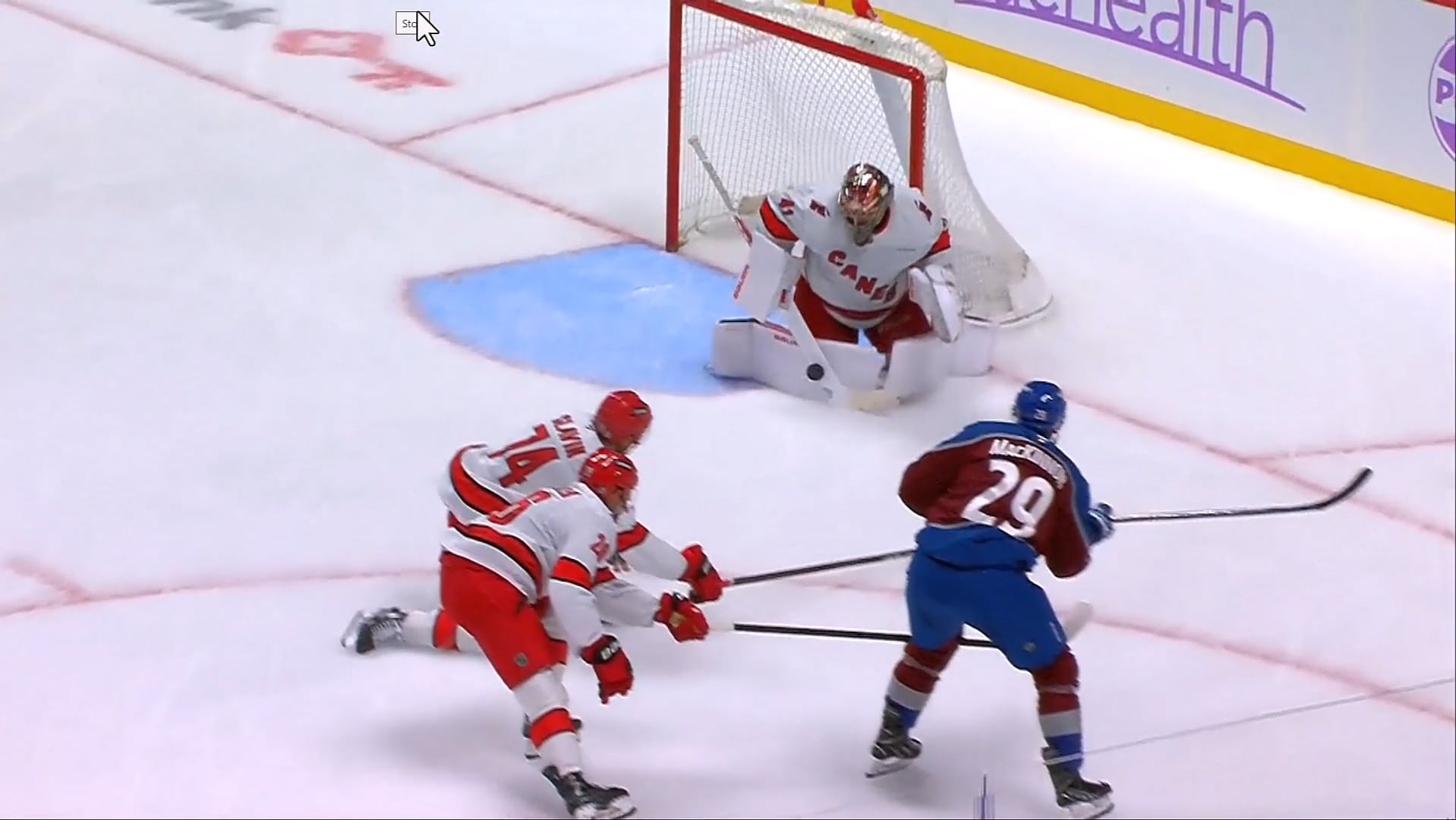 MacKinnon Shoots Far Pad For a Rebound